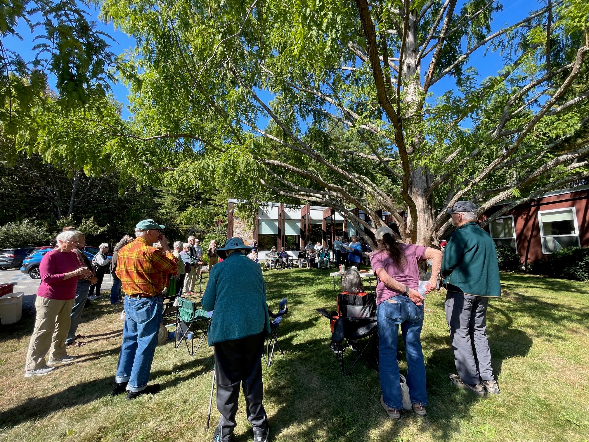 Members of the congregation outdoors on the church lawn